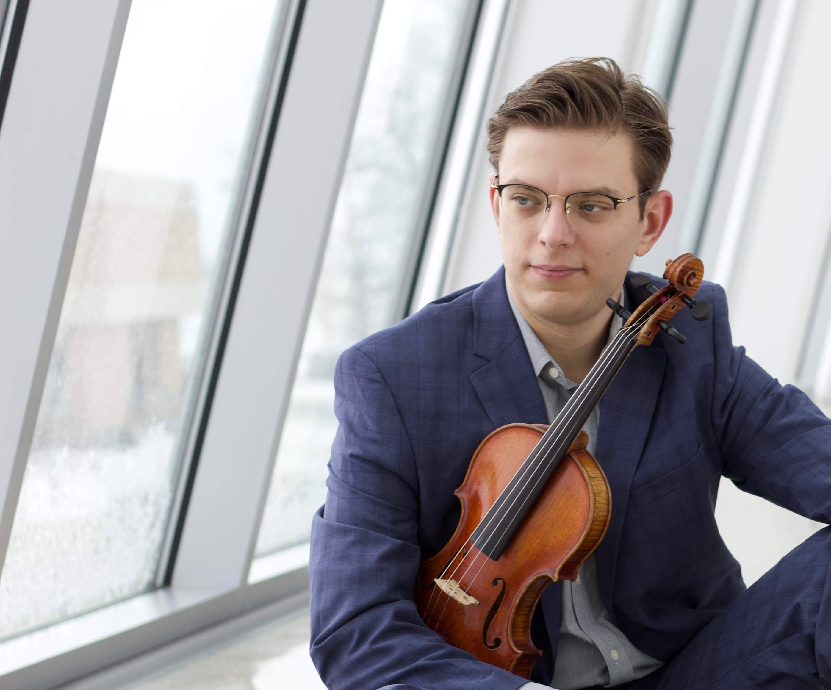 Dr. Alex Malaimare with violin at Marshall University